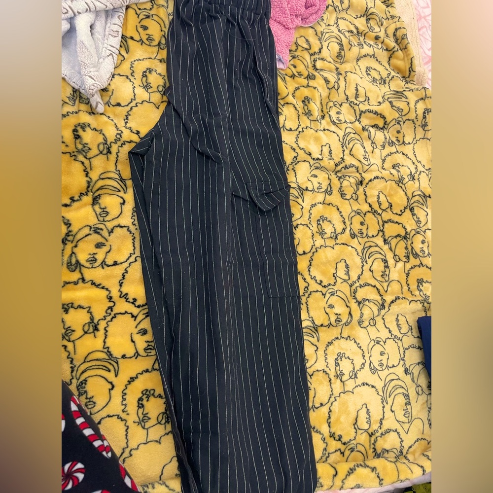 Black elasticated pants with white threaded stripes and pockets